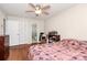 Inviting bedroom with hardwood floors, ample closet space, and ceiling fan at 2629 Vail Ave, Charlotte, NC 28204