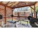 Private covered deck with weight equipment overlooking lush outdoor scenery at 2629 Vail Ave, Charlotte, NC 28204