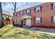 Charming brick building with maroon shutters and a well-manicured lawn at 2629 Vail Ave, Charlotte, NC 28204