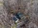 Aerial view of wooded property with home and detached garage at 300 Boyd Rd, Clover, SC 29710