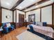 Cozy bedroom with wood beams, floors, and a bright window view at 300 Boyd Rd, Clover, SC 29710