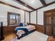 Bright bedroom featuring wood beams, wood trim, and a window view at 300 Boyd Rd, Clover, SC 29710
