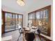 Cozy dining area featuring a round table, modern chairs, and a sliding glass door leading to a deck at 300 Boyd Rd, Clover, SC 29710