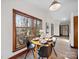 Dining area with a round table, modern chairs, and large windows overlooking a wooded area at 300 Boyd Rd, Clover, SC 29710