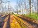 Charming home featuring a welcoming front porch and a natural landscape with a path to the house at 300 Boyd Rd, Clover, SC 29710