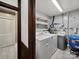 Laundry room area with washer, dryer, shelving, and utilities at 300 Boyd Rd, Clover, SC 29710