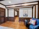 Living room with wood beams, floors, and trim plus a view to another room at 300 Boyd Rd, Clover, SC 29710
