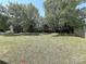 Expansive backyard featuring mature trees and a well-maintained lawn at 3007 Walsingham Ct, Matthews, NC 28105