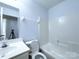 Clean bathroom with a shower and tub, a vanity, and updated fixtures at 3007 Walsingham Ct, Matthews, NC 28105