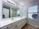 Bathroom featuring a double vanity, large mirror, and a walk-in shower at 3007 Walsingham Ct, Matthews, NC 28105