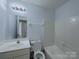 Clean bathroom with a shower and tub, a vanity, and updated fixtures at 3007 Walsingham Ct, Matthews, NC 28105