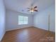Bedroom with ample natural light and a neutral color scheme at 3007 Walsingham Ct, Matthews, NC 28105