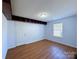 Bedroom featuring hardwood floors, a window, and built in storage space at 3007 Walsingham Ct, Matthews, NC 28105