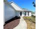 Inviting home entrance featuring a well-kept lawn and easy access walkway to the front door at 3007 Walsingham Ct, Matthews, NC 28105