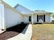 Charming home featuring a well-maintained front lawn and landscaped entryway at 3007 Walsingham Ct, Matthews, NC 28105