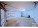 A well lit garage with storage shelving, ample room for parking and storage at 3007 Walsingham Ct, Matthews, NC 28105