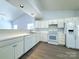 Bright open kitchen featuring white appliances, and ample counter space at 3007 Walsingham Ct, Matthews, NC 28105