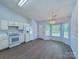 Eat in kitchen with modern appliances, white cabinets, and a bright atmosphere, perfect for casual dining at 3007 Walsingham Ct, Matthews, NC 28105