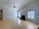 Bright living room featuring vaulted ceiling, fireplace, ceiling fan and light wood floors at 3007 Walsingham Ct, Matthews, NC 28105