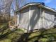 Side view of cozy home featuring siding, a backyard, and convenient access at 301 Huffman Rd, Gastonia, NC 28056
