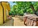 Large back deck with grill and outdoor seating, surrounded by mature trees offering shade and privacy at 302 Griffith Rd, Monroe, NC 28112