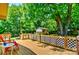 Back deck with outdoor seating, overlooking the backyard featuring a fire pit and storage shed at 302 Griffith Rd, Monroe, NC 28112