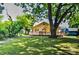 Spacious backyard featuring a large deck, mature trees, and lush greenery, offering a private outdoor retreat at 302 Griffith Rd, Monroe, NC 28112