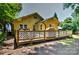 Backyard of house with a deck, and grassy area at 302 Griffith Rd, Monroe, NC 28112