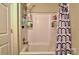 Bathroom with a shower-tub and a patterned shower curtain at 302 Griffith Rd, Monroe, NC 28112