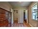 Bedroom featuring wood floors, natural light, dresser, and access to the closet at 302 Griffith Rd, Monroe, NC 28112