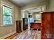 Bedroom featuring wood floors, natural light, and classic wood bedroom furniture at 302 Griffith Rd, Monroe, NC 28112