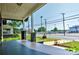 Spacious covered porch with gray flooring, brick columns, and meticulous landscaping at 302 Griffith Rd, Monroe, NC 28112