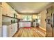 Updated kitchen featuring white cabinets, granite countertops, and stainless steel appliances at 302 Griffith Rd, Monroe, NC 28112