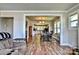 Open-concept living room and dining area with modern flooring and trim, leading to the kitchen at 302 Griffith Rd, Monroe, NC 28112