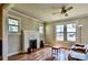 Inviting living room with hardwood floors, charming brick fireplace and large windows at 302 Griffith Rd, Monroe, NC 28112