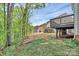 Exterior view showcases homes with wood decks, surrounded by trees and a grassy lawn at 3204 Leah Elizabeth Ln, Monroe, NC 28110