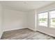 Neutral bedroom featuring neutral paint and wood-look flooring at 3204 Leah Elizabeth Ln, Monroe, NC 28110