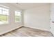 This bedroom has wood-look flooring and double windows providing ample natural light at 3204 Leah Elizabeth Ln, Monroe, NC 28110