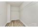 Walk-in closet features wood-look floors, and wire shelving for maximum storage and organization at 3204 Leah Elizabeth Ln, Monroe, NC 28110
