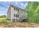 Back exterior elevation features wood deck, neutral siding, and a well-maintained lawn at 3204 Leah Elizabeth Ln, Monroe, NC 28110