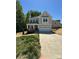 Charming two-story home with a two-car garage and a well-manicured front lawn at 3204 Leah Elizabeth Ln, Monroe, NC 28110