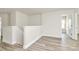 Neutral hallway featuring neutral paint and wood-look flooring at 3204 Leah Elizabeth Ln, Monroe, NC 28110