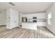 Bright kitchen featuring stainless steel appliances, a granite island and white cabinets at 3204 Leah Elizabeth Ln, Monroe, NC 28110