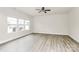 Bright living room featuring neutral paint, wood-look flooring and plenty of natural light at 3204 Leah Elizabeth Ln, Monroe, NC 28110