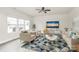 Inviting living room with a patterned rug, comfortable seating, and a bright window view at 3204 Leah Elizabeth Ln, Monroe, NC 28110