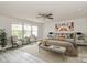 Spacious main bedroom with ample natural light, neutral tones, and a cozy seating area at 3204 Leah Elizabeth Ln, Monroe, NC 28110