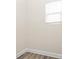 Small empty room featuring laminate flooring, neutral walls, white trim, and a window with white blinds at 3204 Leah Elizabeth Ln, Monroe, NC 28110
