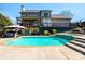 Backyard with a swimming pool, multi-level deck, and a charming gazebo, creating a perfect outdoor oasis at 3765 11Th Ne St, Hickory, NC 28601