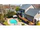 Aerial view of backyard with a refreshing pool, hot tub, gazebo, and spacious wooden deck at 3765 11Th Ne St, Hickory, NC 28601