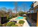 Beautiful backyard with in-ground pool and spa, mature trees, lush landscaping, and a gazebo area at 3765 11Th Ne St, Hickory, NC 28601
